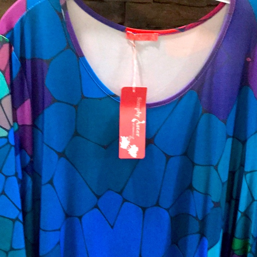 Vibrant tunic. New with tags.